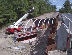 A Bridge-in-a-Backpack being erected in Maine. Image courtesy of ENR.com and Maine DOT.