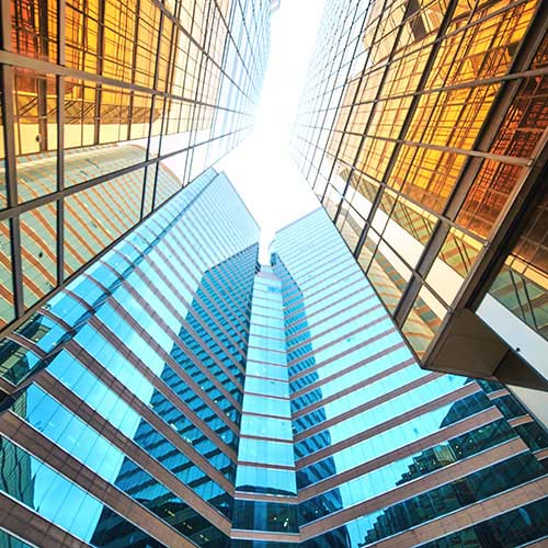 View looking up to the sky between buildings