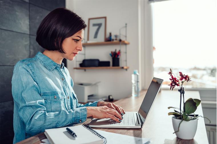 woman sitting at home on laptop