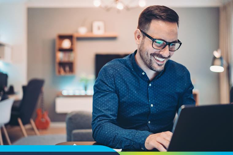 man sitting at computer