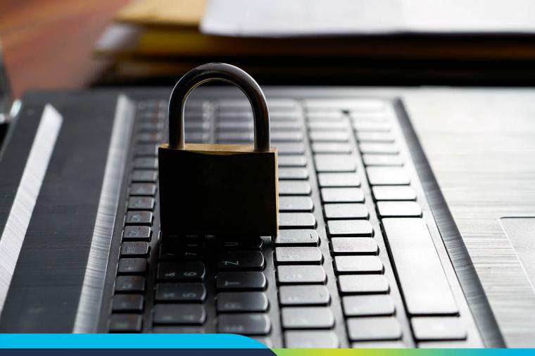 Side view of a laptop keyboard with a locked padlock. Work-From-Home Is Likely Here to Stay—What’s Your Strategy for User Experience?