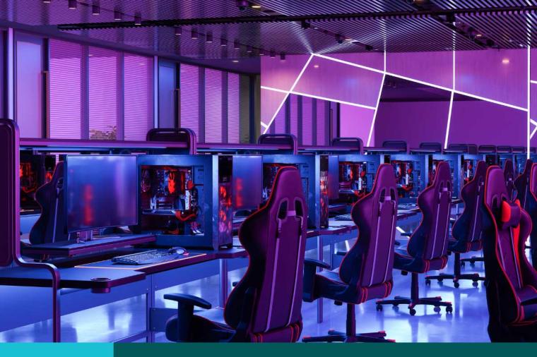 Room full of gaming chairs and computers