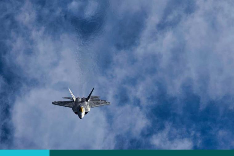 U.S. fighter jet flying above the clouds