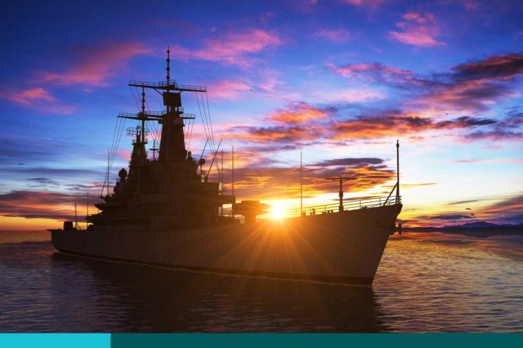 American Modern Warship On The Background Of Sunset.