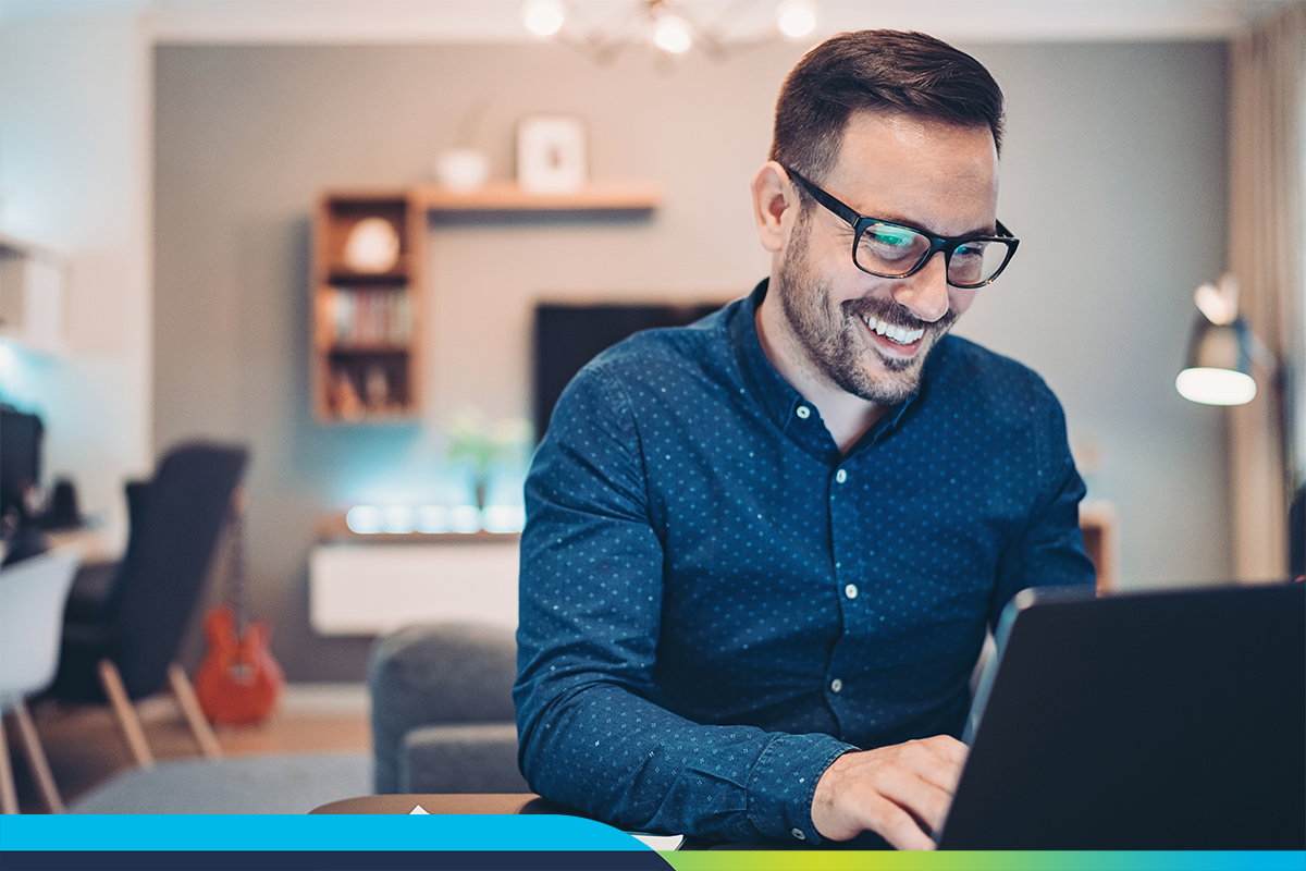 man sitting at computer