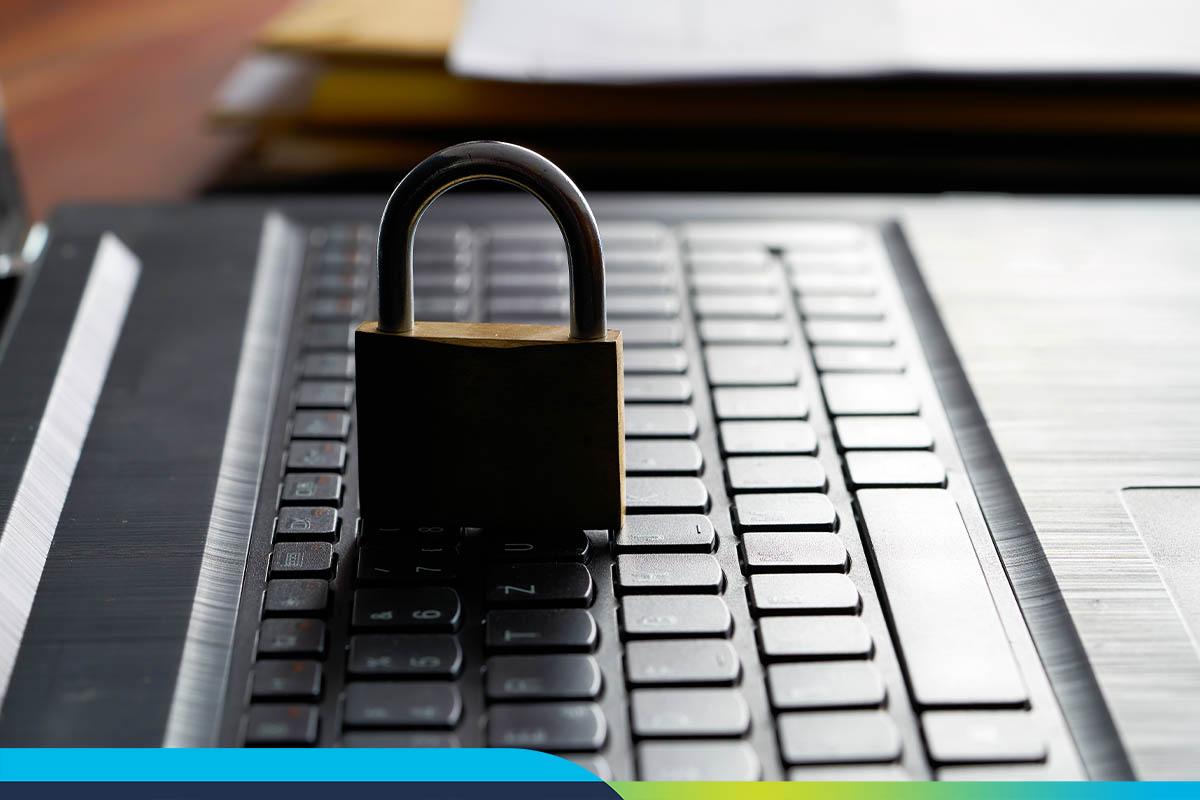 Side view of a laptop keyboard with a locked padlock. Work-From-Home Is Likely Here to Stay—What’s Your Strategy for User Experience?
