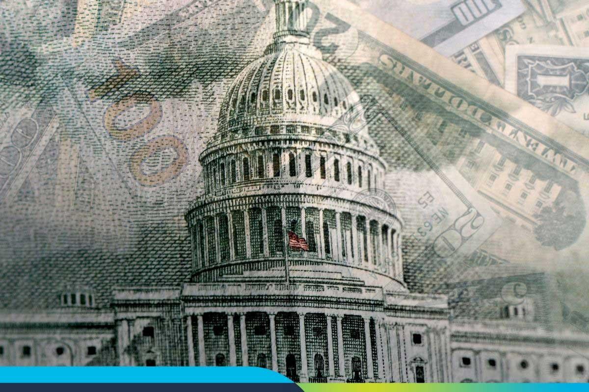 U.S currency bills superimposed over the Capitol