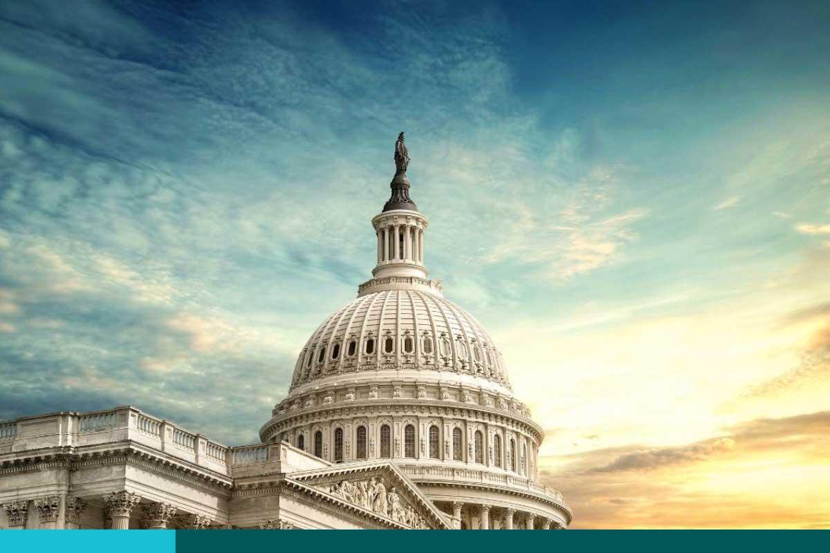 U.S. Capitol highlighted against a sunny sky