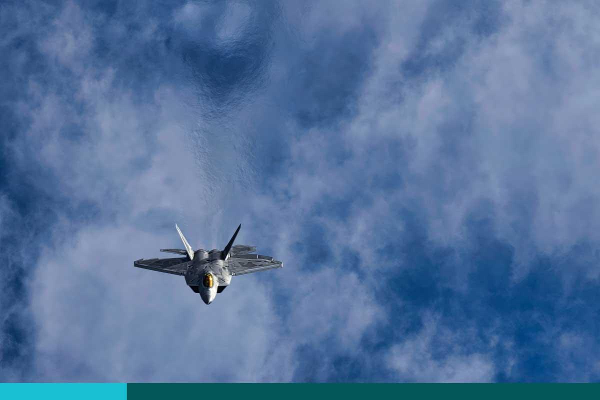 U.S. fighter jet flying above the clouds