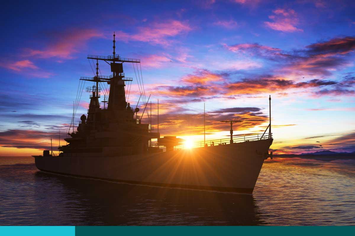 American Modern Warship On The Background Of Sunset.