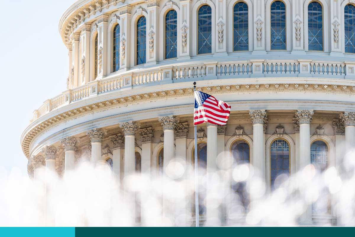 US Congress dome closeup with background of water fountain splashing, American flag waving in Washington DC, USA closeup on Capital capitol hill, columns, pillars